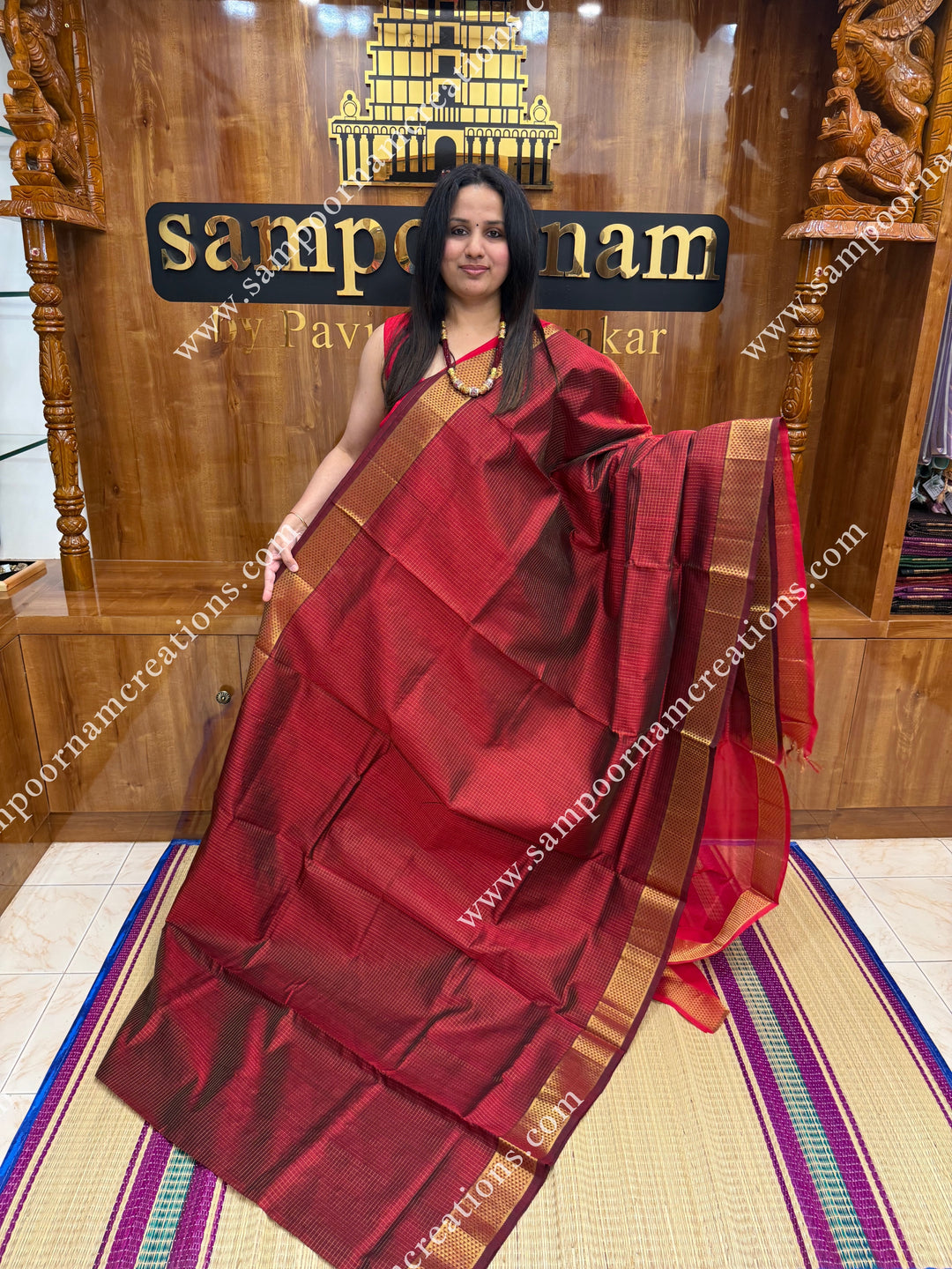 Maroon with Red , Rich Zari Checks in the body , traditional borders and rich Pallu Silk Cotton Sarees