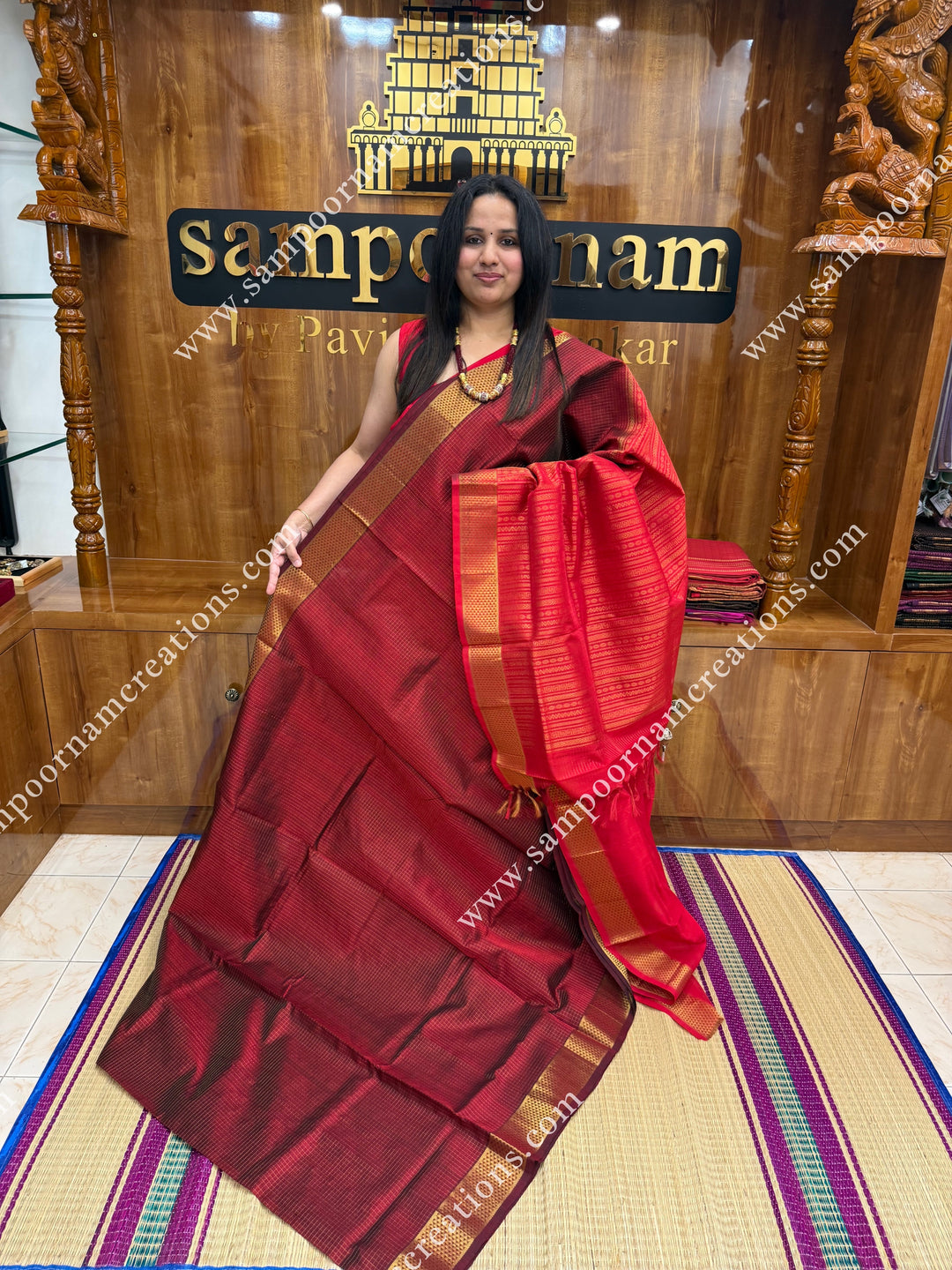 Maroon with Red , Rich Zari Checks in the body , traditional borders and rich Pallu Silk Cotton Sarees