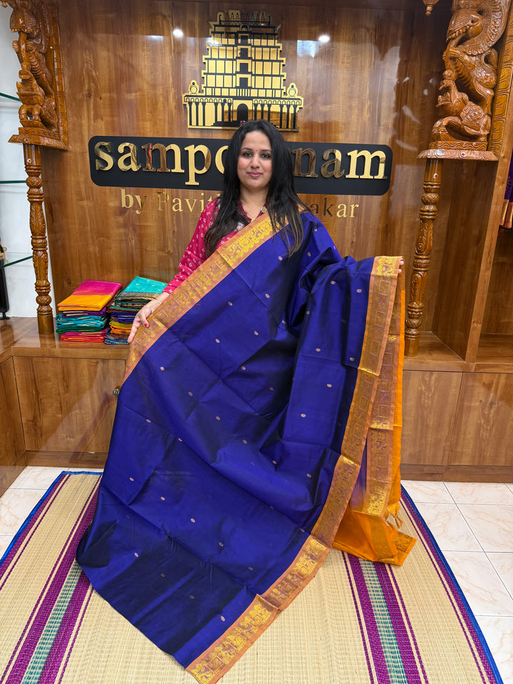 Ms Blue with Mustard , rich Zari butta in the body , Traditional Big Borders and rich Pallu  Silk Cotton Saree