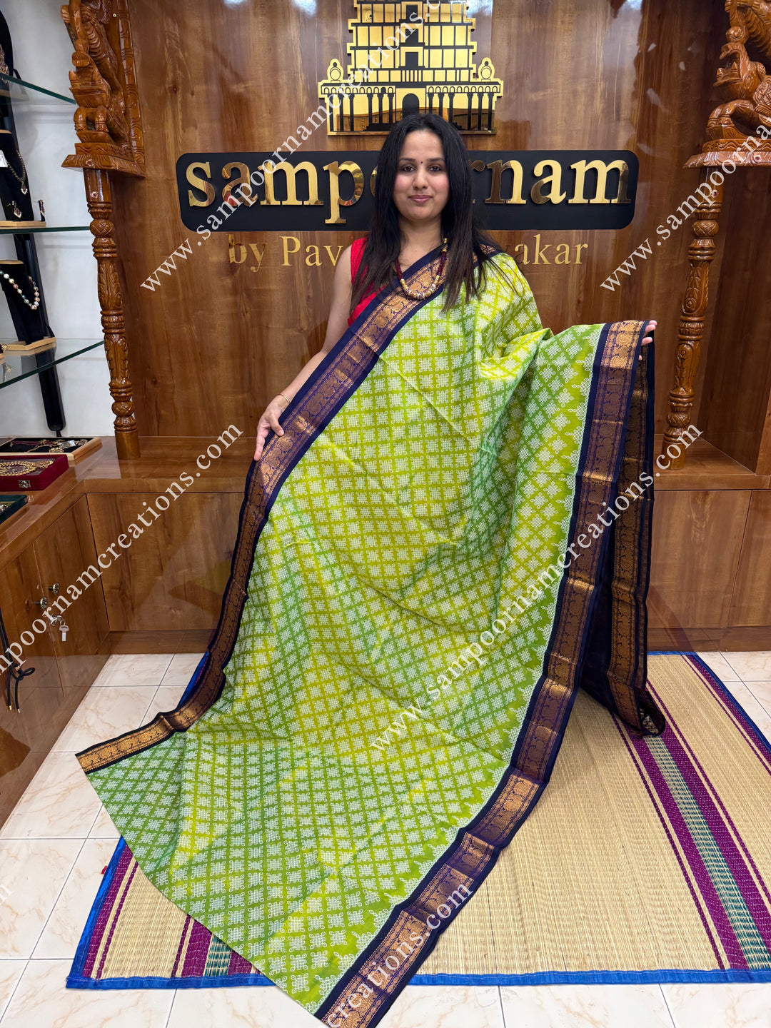 Parrot Green with Dark Blue , Kolam Prints all over the body , traditional borders and rich Pallu Korvai Silk Cotton Saree