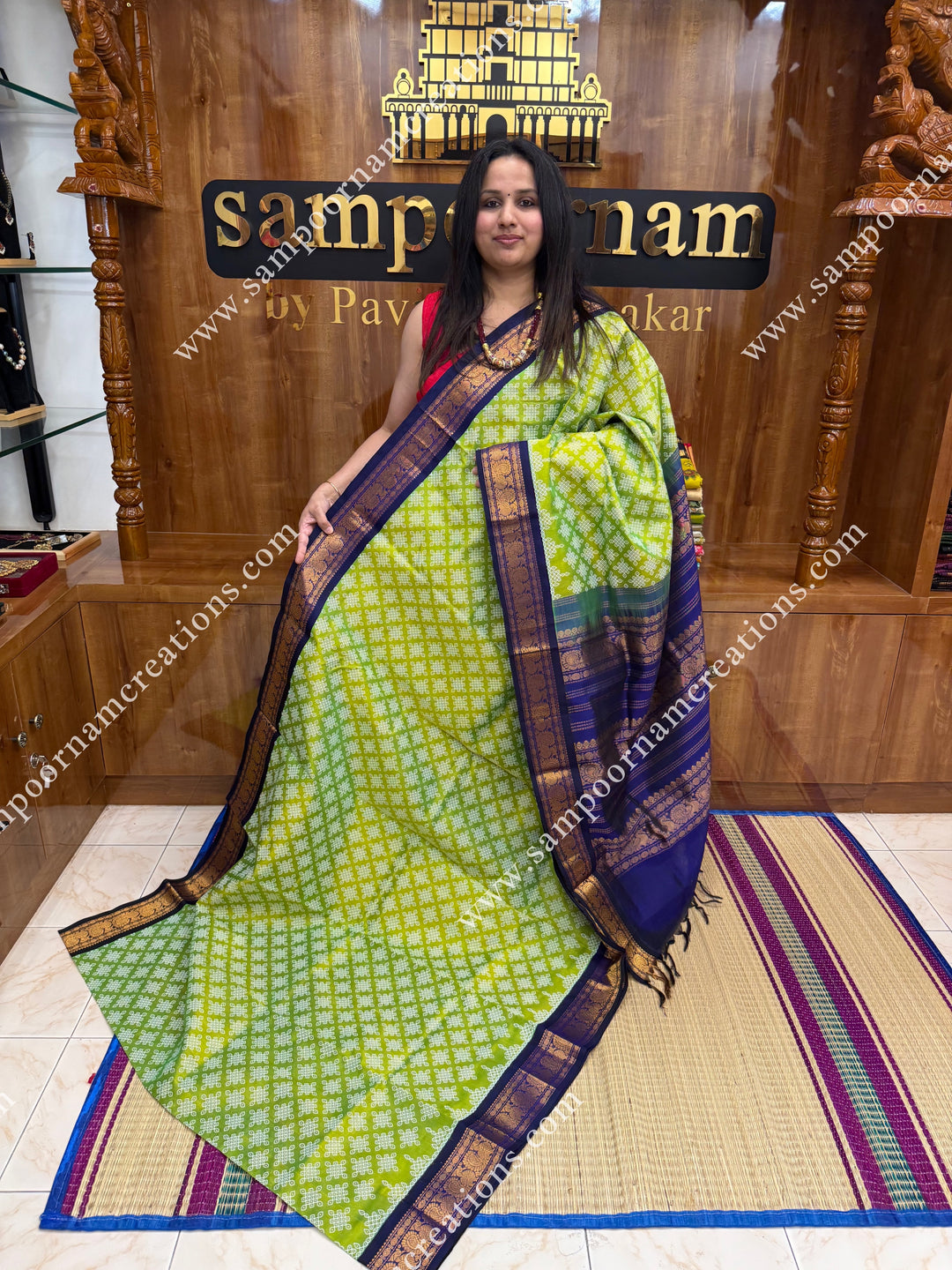 Parrot Green with Dark Blue , Kolam Prints all over the body , traditional borders and rich Pallu Korvai Silk Cotton Saree