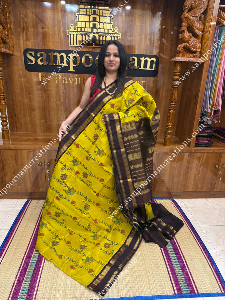 Lemon Yellow with Dark Brown, Floral Madhubani  Prints all over the body , rettapet borders and rich Pallu Korvai Silk Cotton Saree