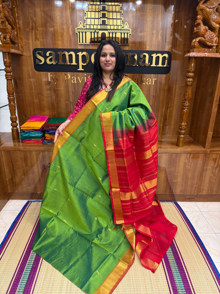 Parrot Green with maroon , rich Mango Zari butta in the body , Traditional Big Borders and rich Pallu  Silk Cotton Saree