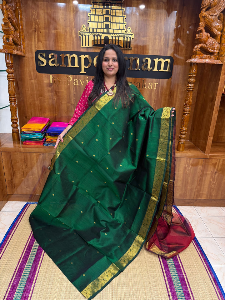 Green with Maroon  , rich Zari butta in the body , Traditional Big Borders and rich Pallu  Silk Cotton Saree