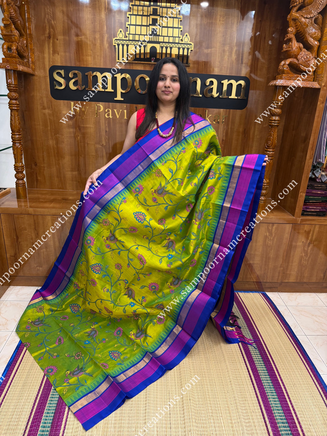 Sneha Green with Blue, Floral Madhubani  Prints all over the body , Triple borders with Temple design and rich Pallu Korvai Silk Cotton Saree