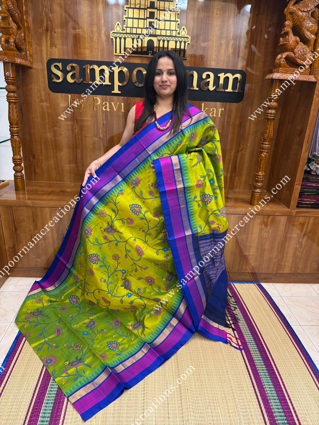 Sneha Green with Blue, Floral Madhubani  Prints all over the body , Triple borders with Temple design and rich Pallu Korvai Silk Cotton Saree