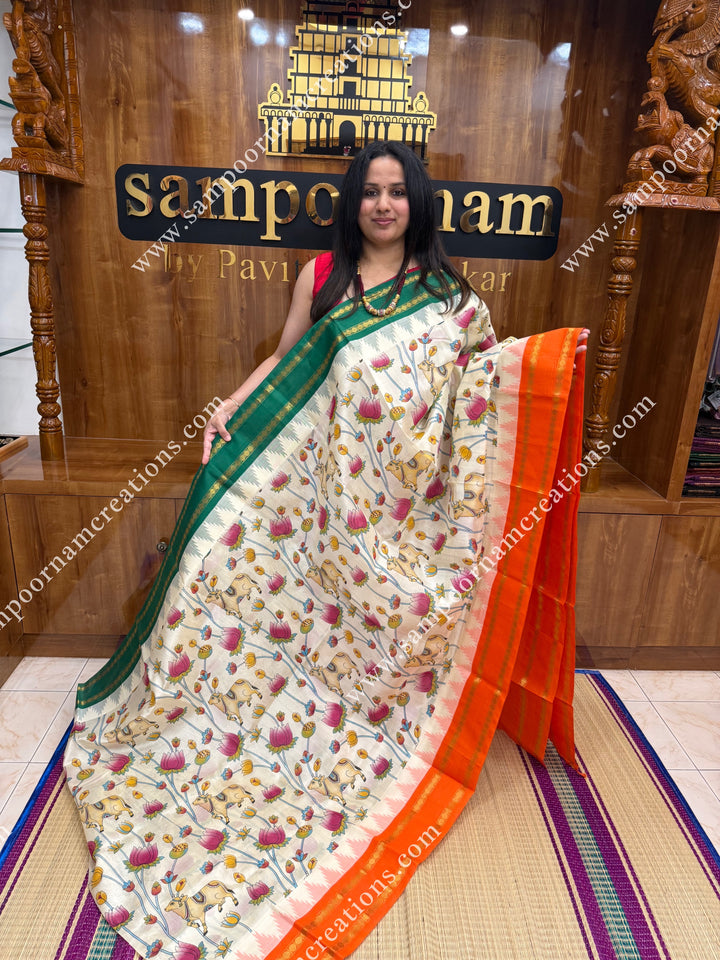 Offwhite with Orange  , Pichwai  Prints all over the body , Green and Orange Ganga Jamuna Border with Temple design  and Rich Pallu Korvai Silk Cotton Saree