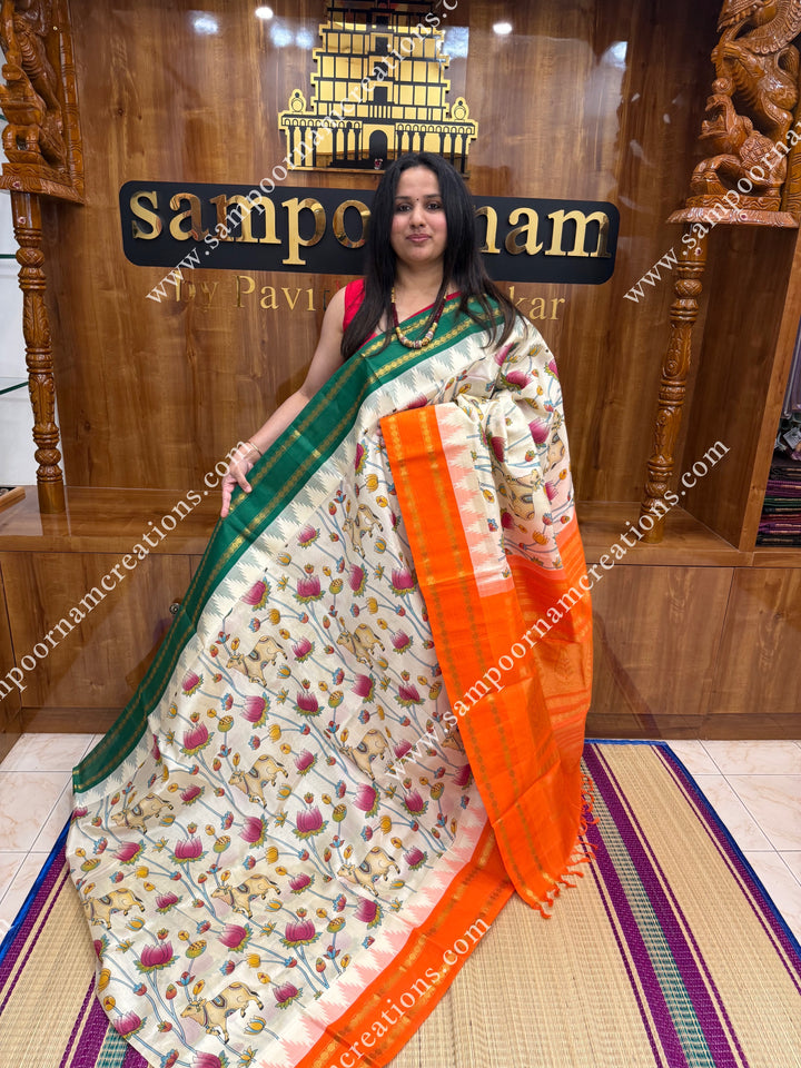 Offwhite with Orange  , Pichwai  Prints all over the body , Green and Orange Ganga Jamuna Border with Temple design  and Rich Pallu Korvai Silk Cotton Saree