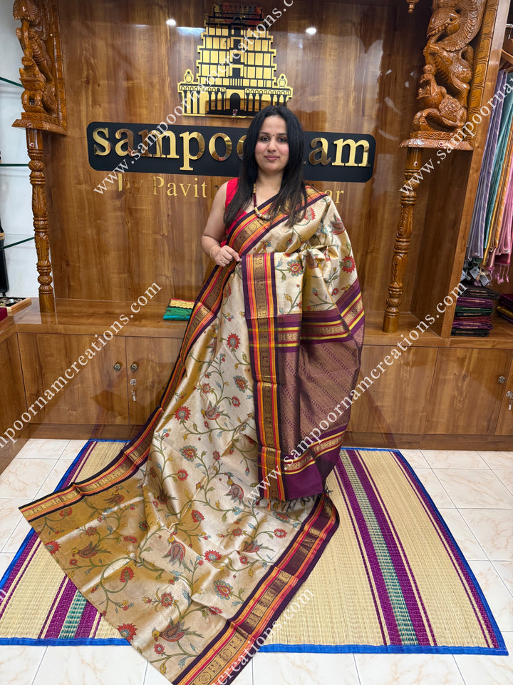 Gold with Wine , Floral Madhubani  Prints all over the body , Traditional borders and rich Pallu Korvai Silk Cotton Saree