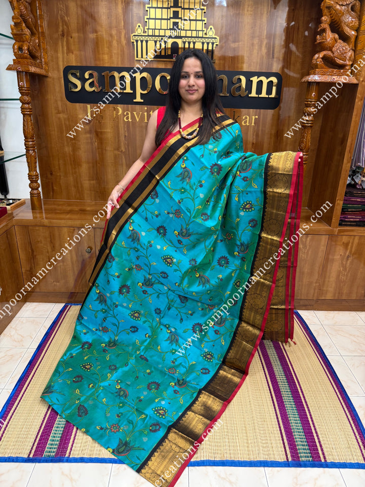 Rexona Green with Black ,  Floral Madhubani  Prints all over the body , Traditional one side long borders and rich Pallu Korvai Silk Cotton Saree