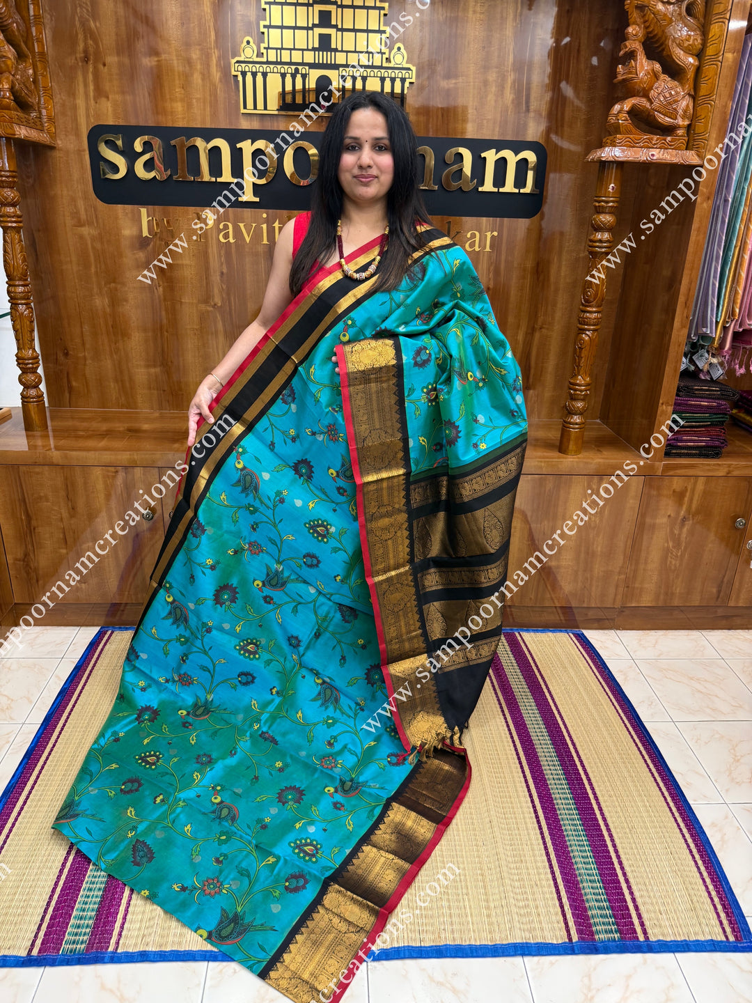 Rexona Green with Black ,  Floral Madhubani  Prints all over the body , Traditional one side long borders and rich Pallu Korvai Silk Cotton Saree