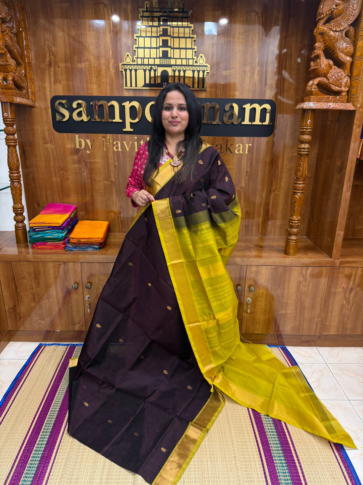 Dark Brown with Green  , rich Flower Zari butta in the body , Traditional Big Borders and rich Pallu  Silk Cotton Saree