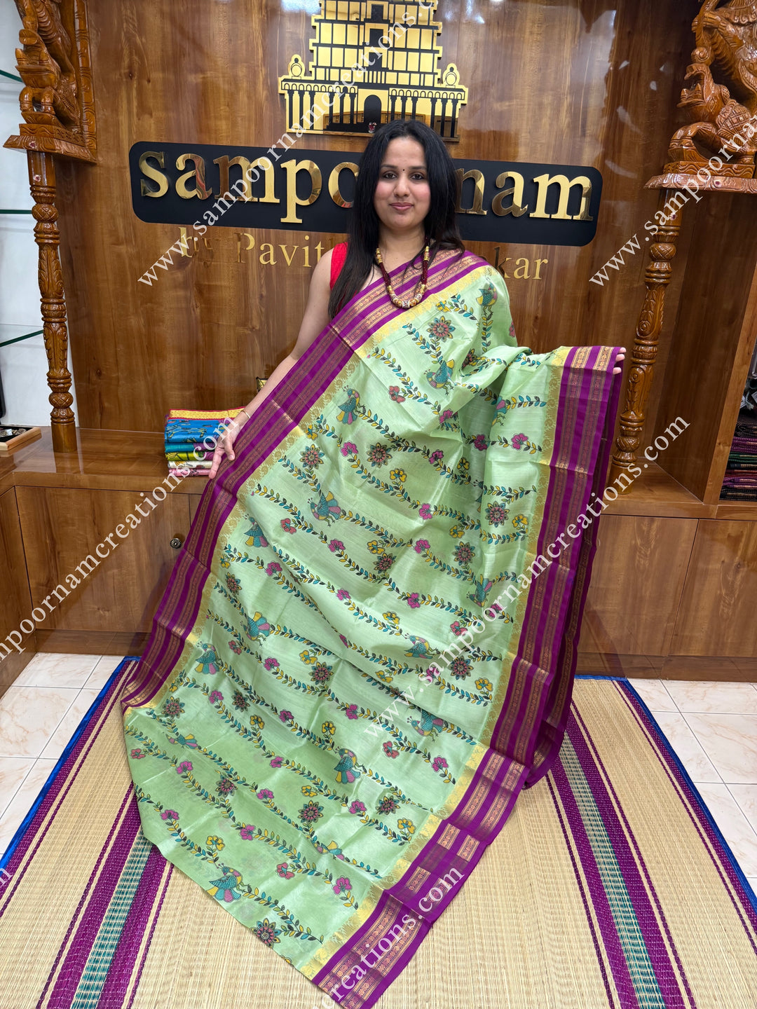 Pastel Green  with Megenta, Floral Madhubani  Prints all over the body , rettapet borders with temple design and rich Pallu Korvai Silk Cotton Saree
