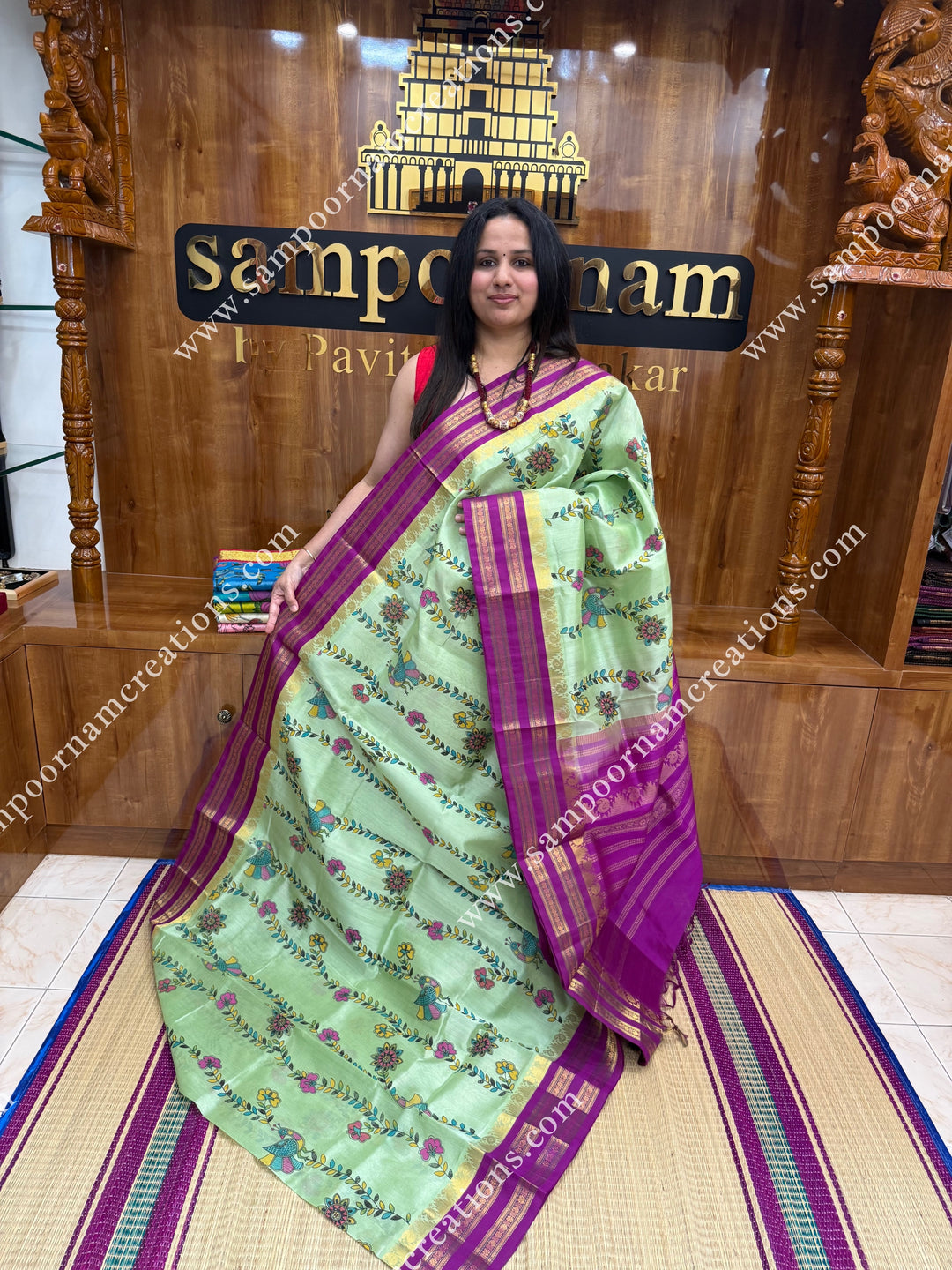 Pastel Green  with Megenta, Floral Madhubani  Prints all over the body , rettapet borders with temple design and rich Pallu Korvai Silk Cotton Saree