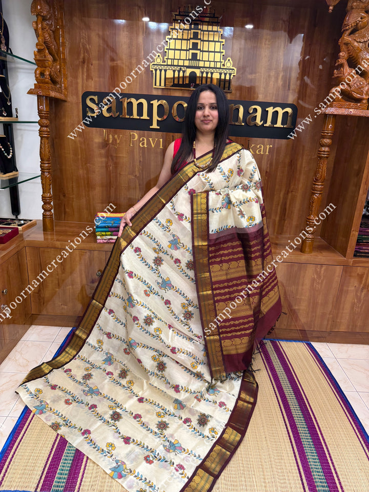 Off White with Wine, Floral Madhubani  Prints all over the body , traditional borders and rich Pallu Korvai Silk Cotton Saree