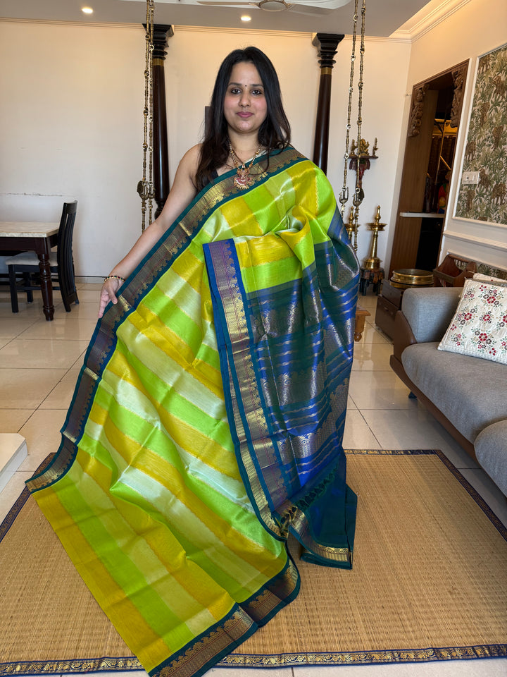 A fusion of Pastel Shades of Green with mayilkazhuthu Blue, traditional borders and Rich Pallu Korvai Silk Cotton Saree