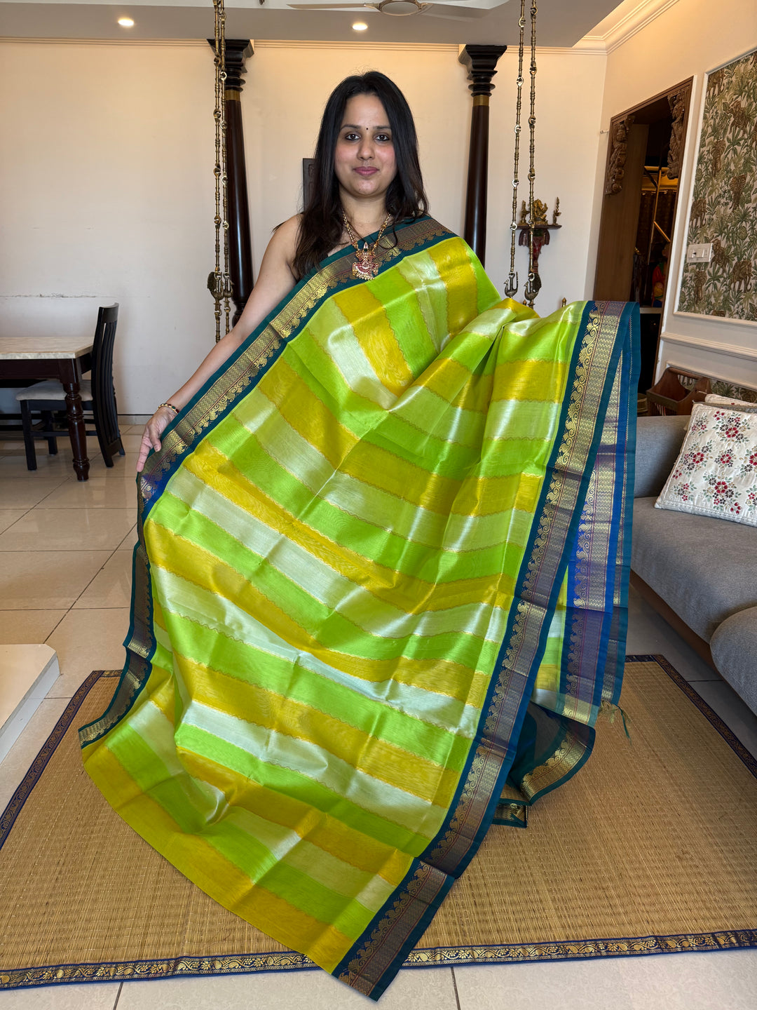 A fusion of Pastel Shades of Green with mayilkazhuthu Blue, traditional borders and Rich Pallu Korvai Silk Cotton Saree