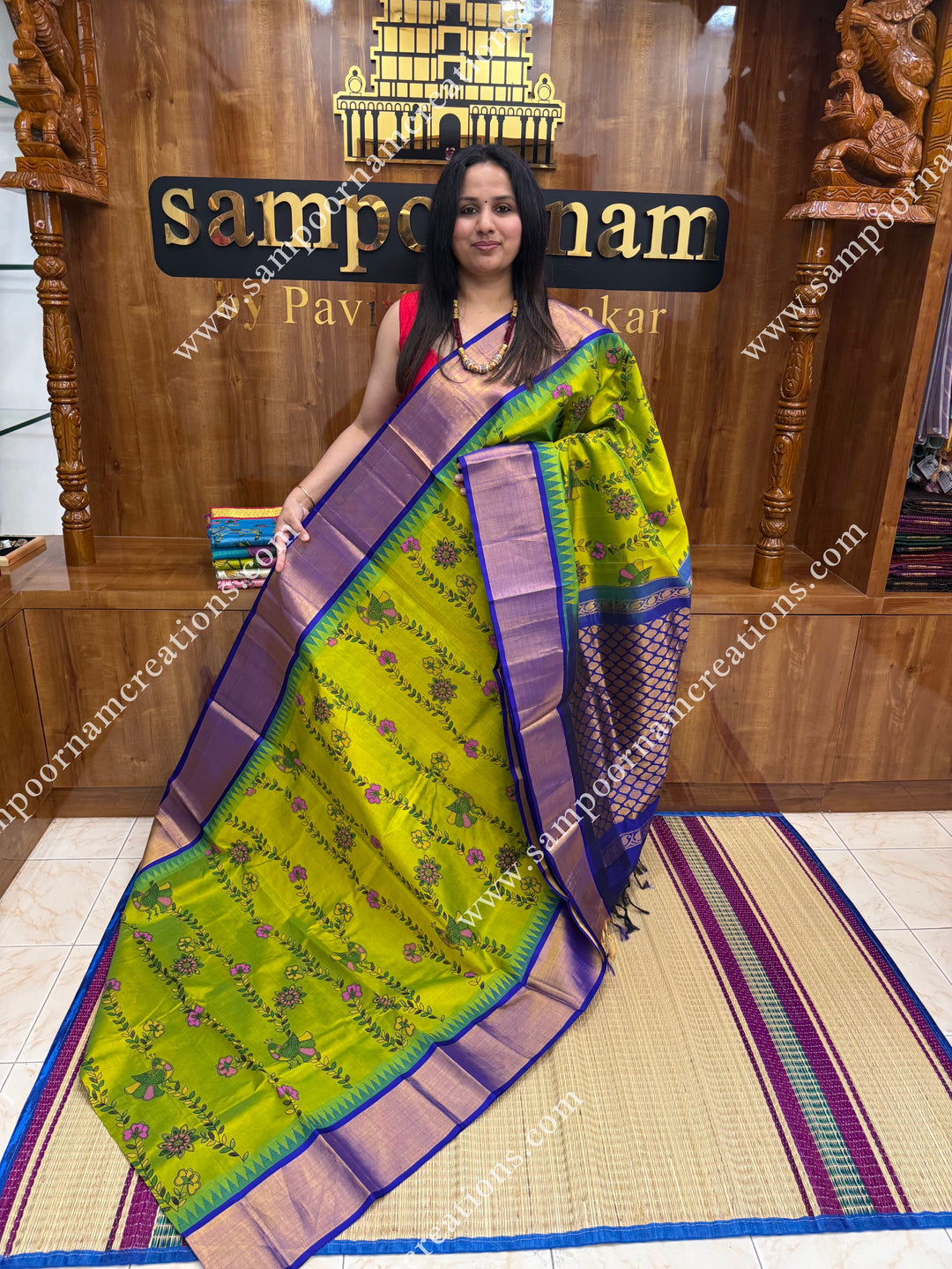 Sneha Green with Blue , Floral Madhubani  Prints all over the body , Tissue borders with Temple design and rich Pallu Korvai Silk Cotton Saree