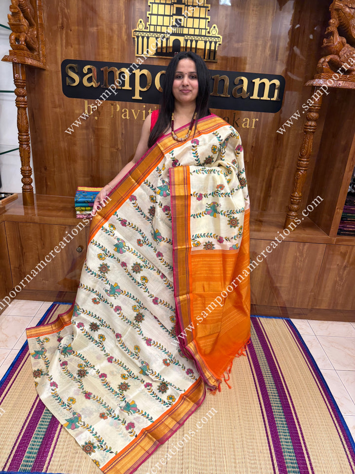 Offwhite with Orange  , Floral Madhubani  Prints all over the body , traditional borders and rich Pallu Korvai Silk Cotton Saree