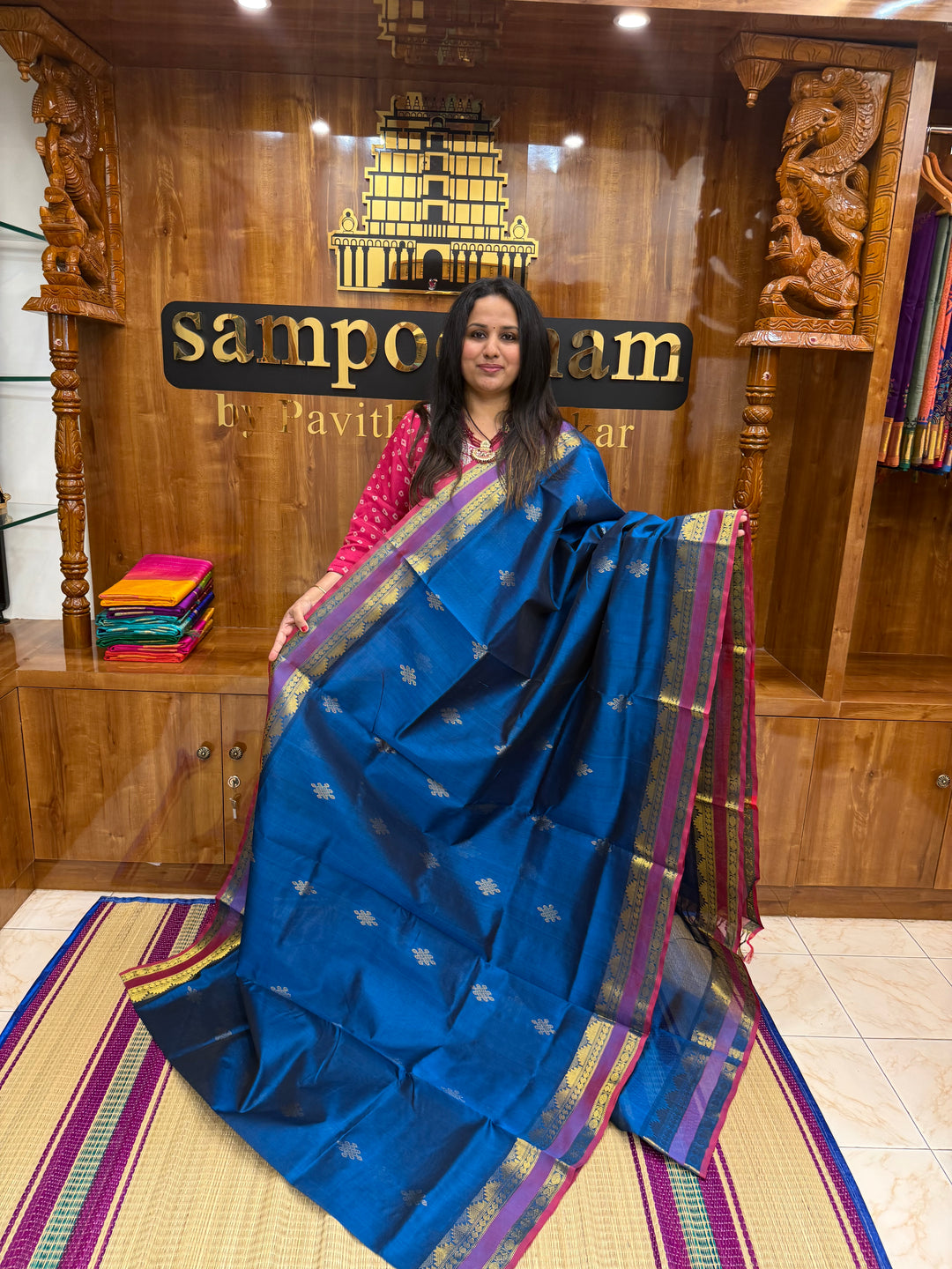 Mayilkazhuthu Blue with Red Selvedge , rich Kolam Zari butta in the body , Rettapet borders and rich Pallu Silk Cotton Saree
