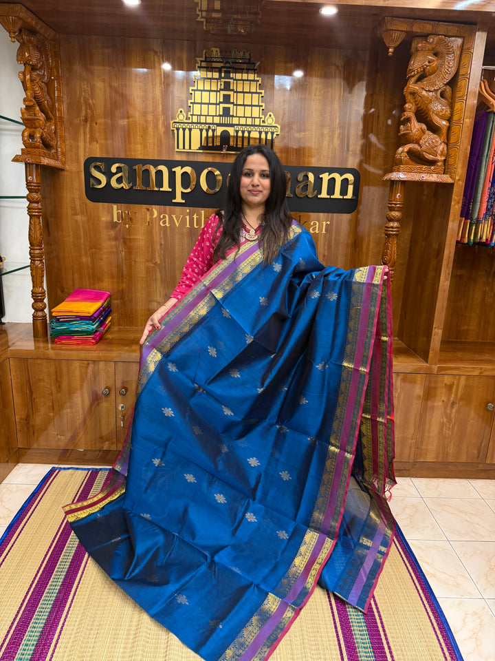 Mayilkazhuthu Blue with Red Selvedge , rich Kolam Zari butta in the body , Rettapet borders and rich Pallu Silk Cotton Saree