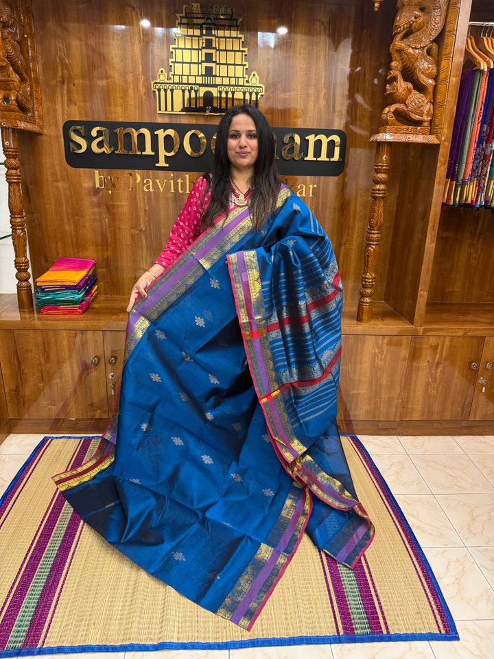 Mayilkazhuthu Blue with Red Selvedge , rich Kolam Zari butta in the body , Rettapet borders and rich Pallu Silk Cotton Saree