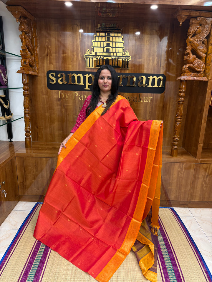 Orange with Light Brown , rich Zari butta in the body , Traditional Big Borders and rich Pallu  Silk Cotton Saree