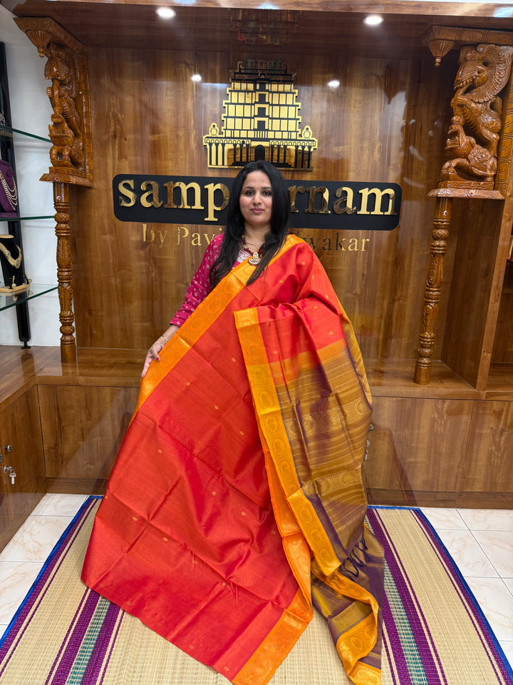 Orange with Light Brown , rich Zari butta in the body , Traditional Big Borders and rich Pallu  Silk Cotton Saree