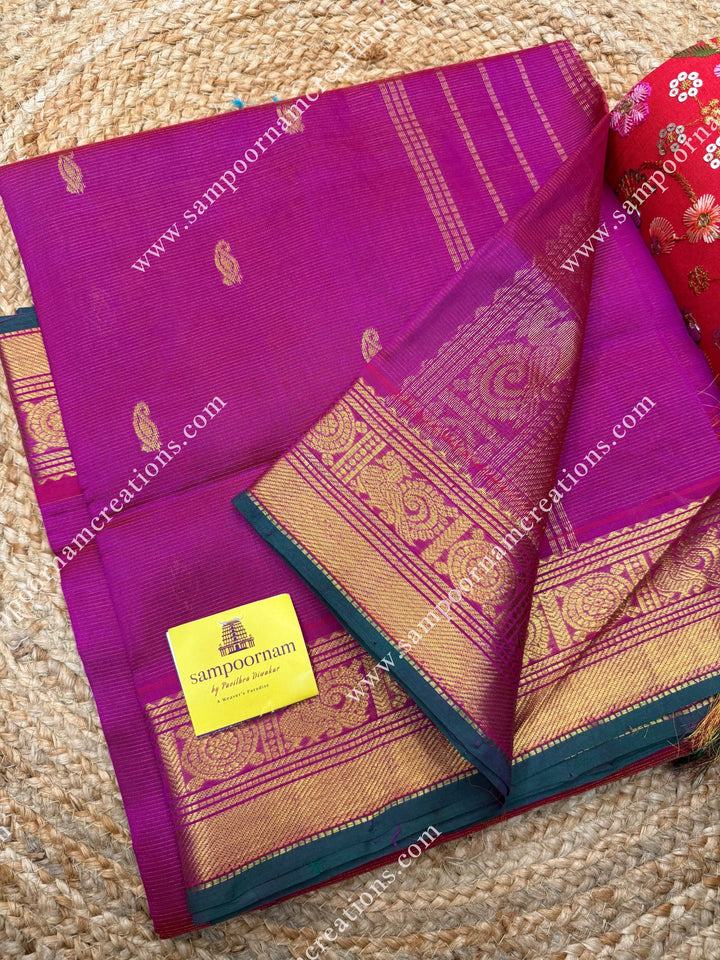 Rani Pink , Green Selvedge , Vairaoosi Zari lines and Mango Zari Butta in the body , traditional borders and rich Pallu Silk Cotton Sarees