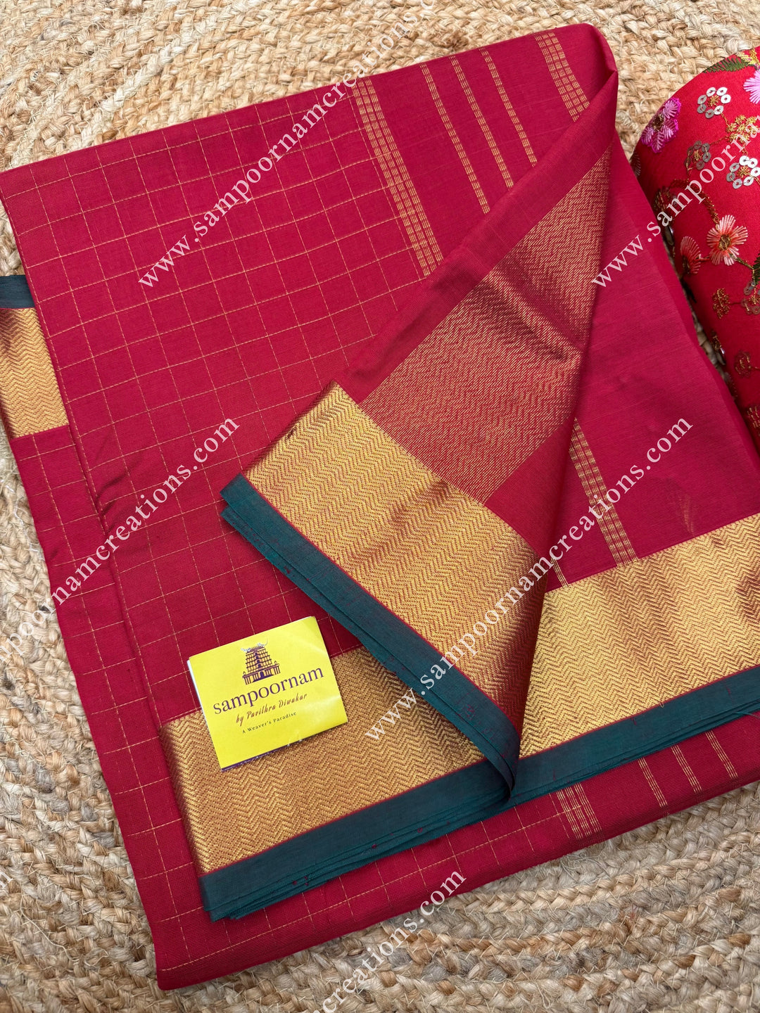 Classic Red  , Green Selvedge , Rich Zari Checks in the body , traditional borders and rich Pallu Silk Cotton Saree
