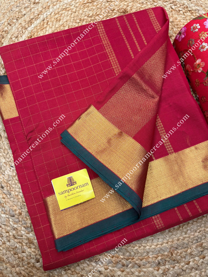 Classic Red  , Green Selvedge , Rich Zari Checks in the body , traditional borders and rich Pallu Silk Cotton Saree