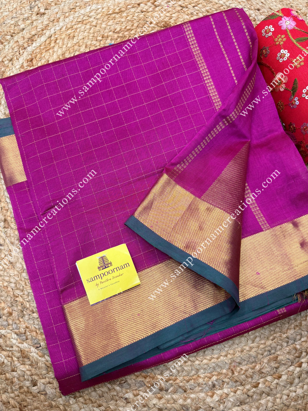 Dark Magenta , Green Selvedge , Rich Zari Checks in the body , traditional borders and rich Pallu Silk Cotton Saree