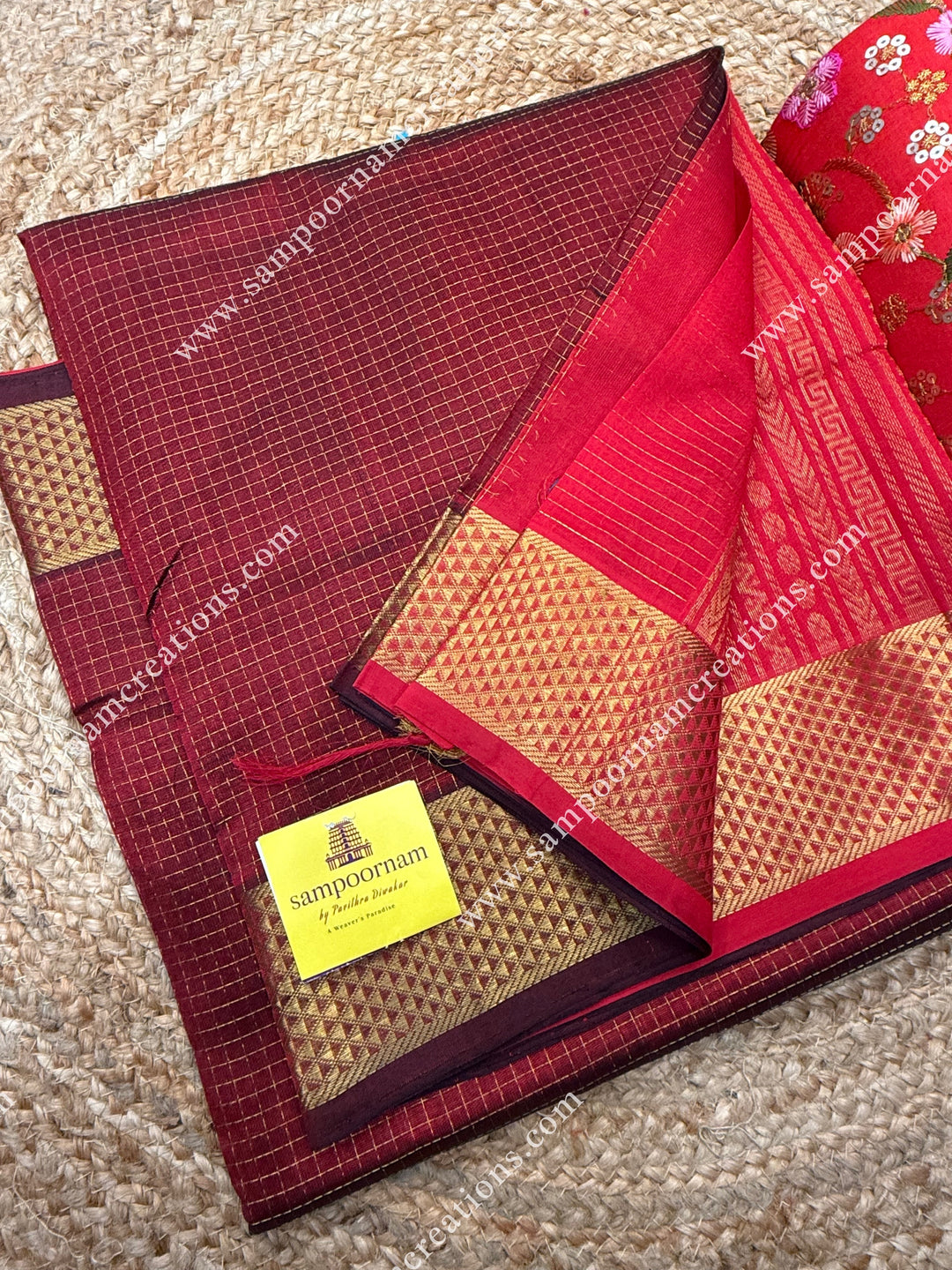 Maroon with Red , Rich Zari Checks in the body , traditional borders and rich Pallu Silk Cotton Sarees