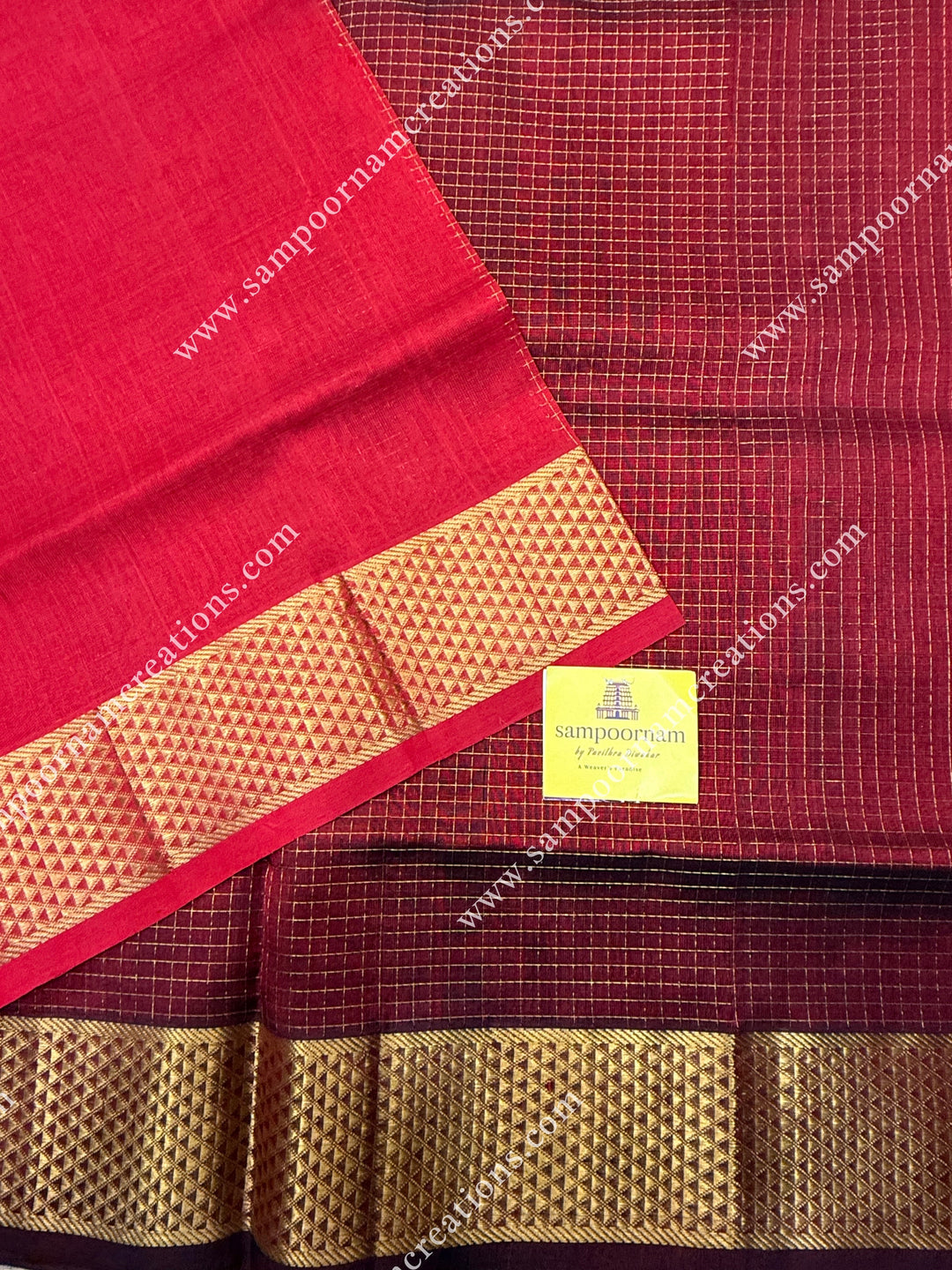 Maroon with Red , Rich Zari Checks in the body , traditional borders and rich Pallu Silk Cotton Sarees