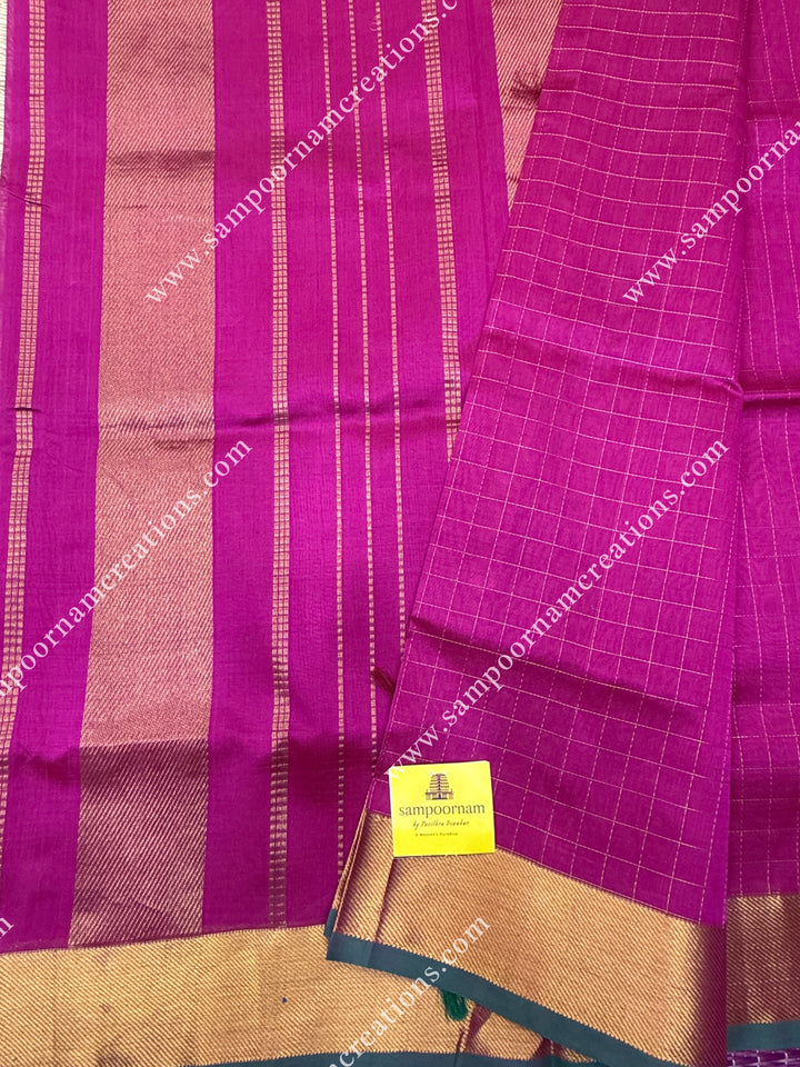Dark Magenta , Green Selvedge , Rich Zari Checks in the body , traditional borders and rich Pallu Silk Cotton Saree