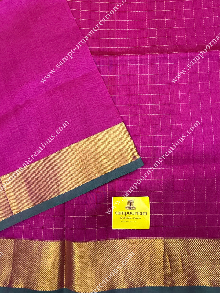 Dark Magenta , Green Selvedge , Rich Zari Checks in the body , traditional borders and rich Pallu Silk Cotton Saree