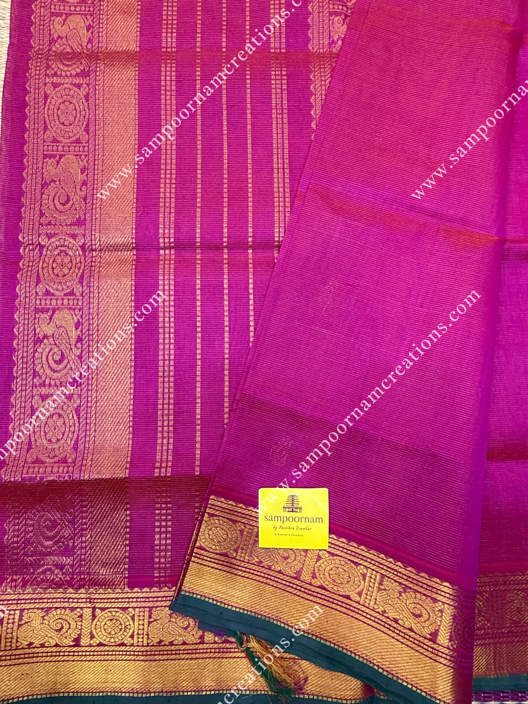Rani Pink , Green Selvedge , Vairaoosi Zari lines and Mango Zari Butta in the body , traditional borders and rich Pallu Silk Cotton Sarees
