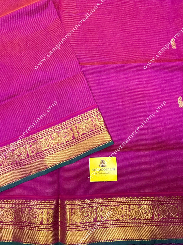 Rani Pink , Green Selvedge , Vairaoosi Zari lines and Mango Zari Butta in the body , traditional borders and rich Pallu Silk Cotton Sarees