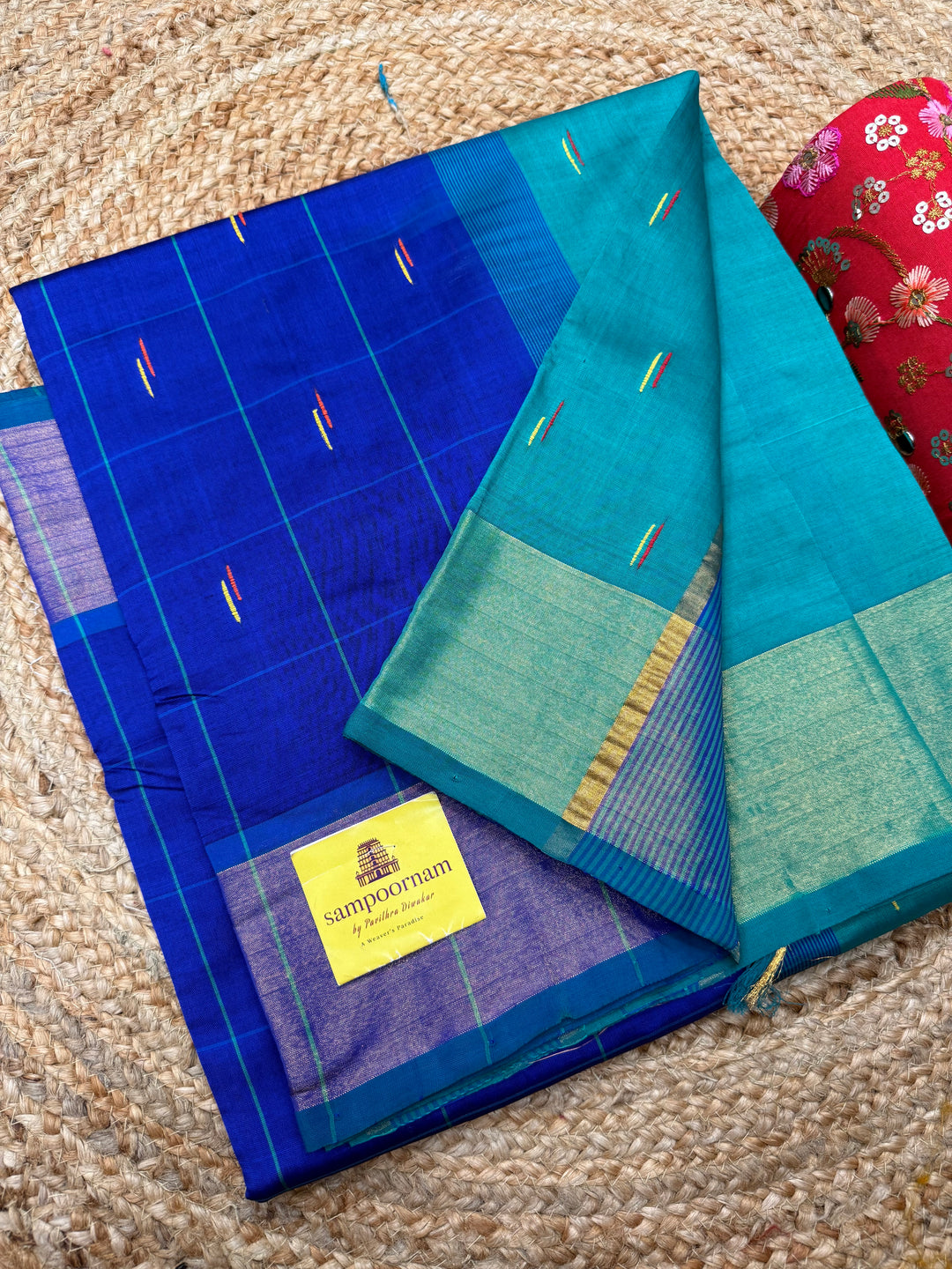 Blue with Green , checks in the body and rain drop thread butta in the body and Pallu Semi Silk Cotton Saree