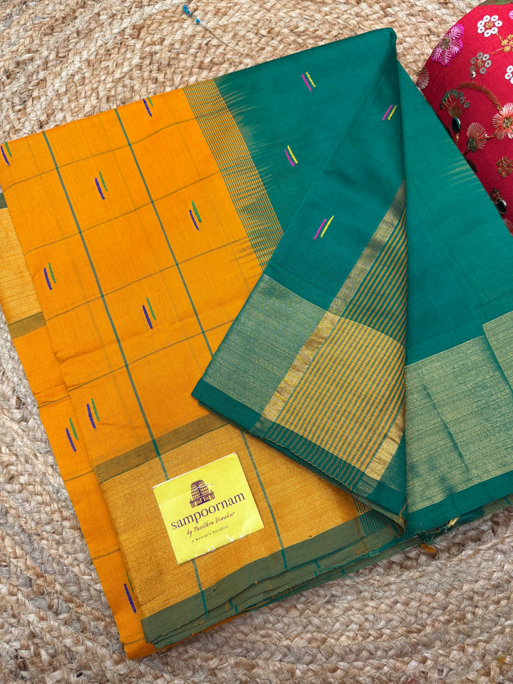 Orange with Green , checks in the body and rain drop thread butta in the body and Pallu Semi Silk Cotton Saree