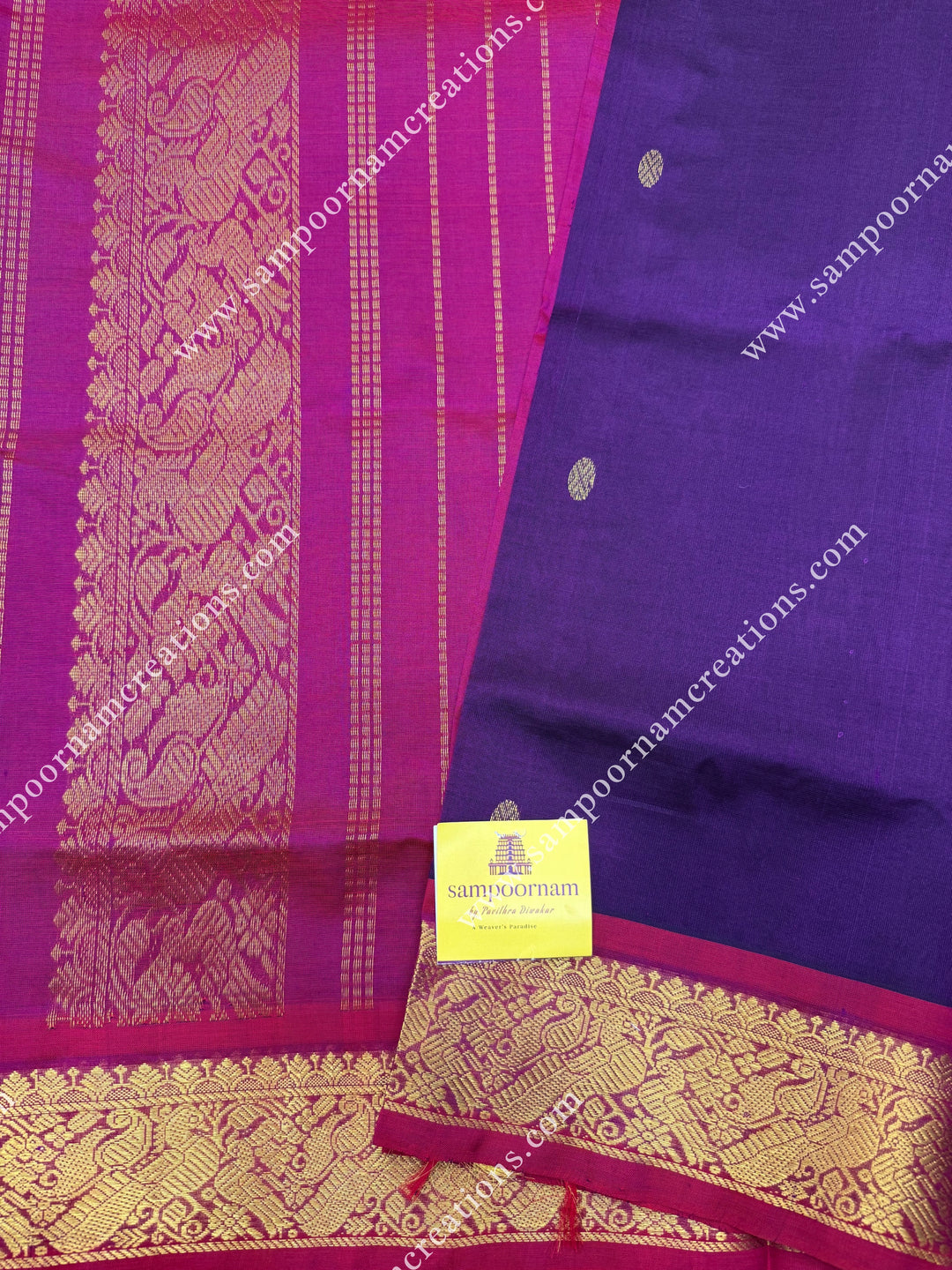 Wine with Magenta , Rich Zari Butta in the body , traditional borders and rich Pallu Silk Cotton Saree