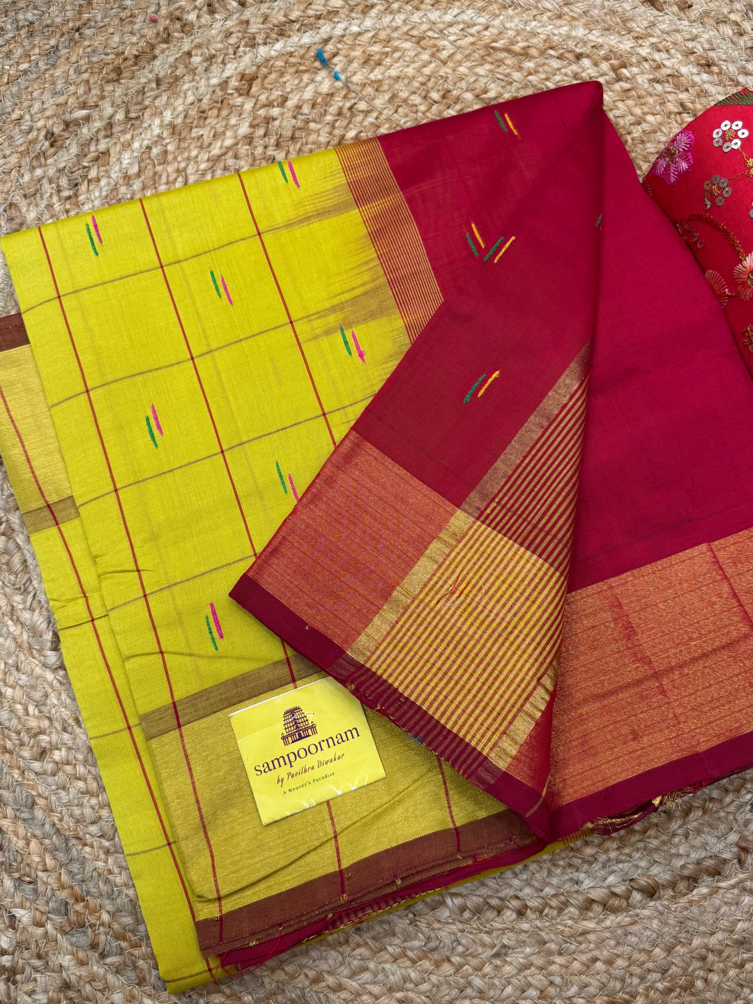 Yellow with Red , checks in the body and rain drop thread butta in the body and Pallu Semi Silk Cotton Saree