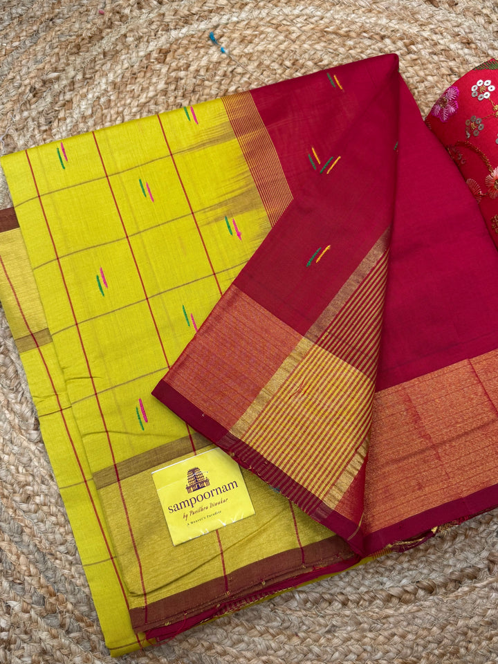 Yellow with Red , checks in the body and rain drop thread butta in the body and Pallu Semi Silk Cotton Saree