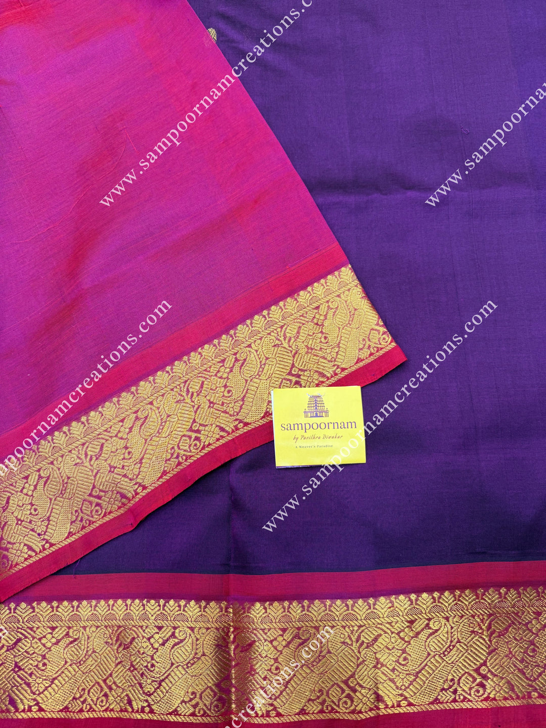 Wine with Magenta , Rich Zari Butta in the body , traditional borders and rich Pallu Silk Cotton Saree