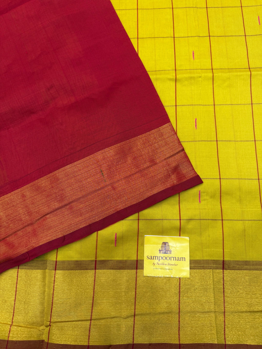 Yellow with Red , checks in the body and rain drop thread butta in the body and Pallu Semi Silk Cotton Saree