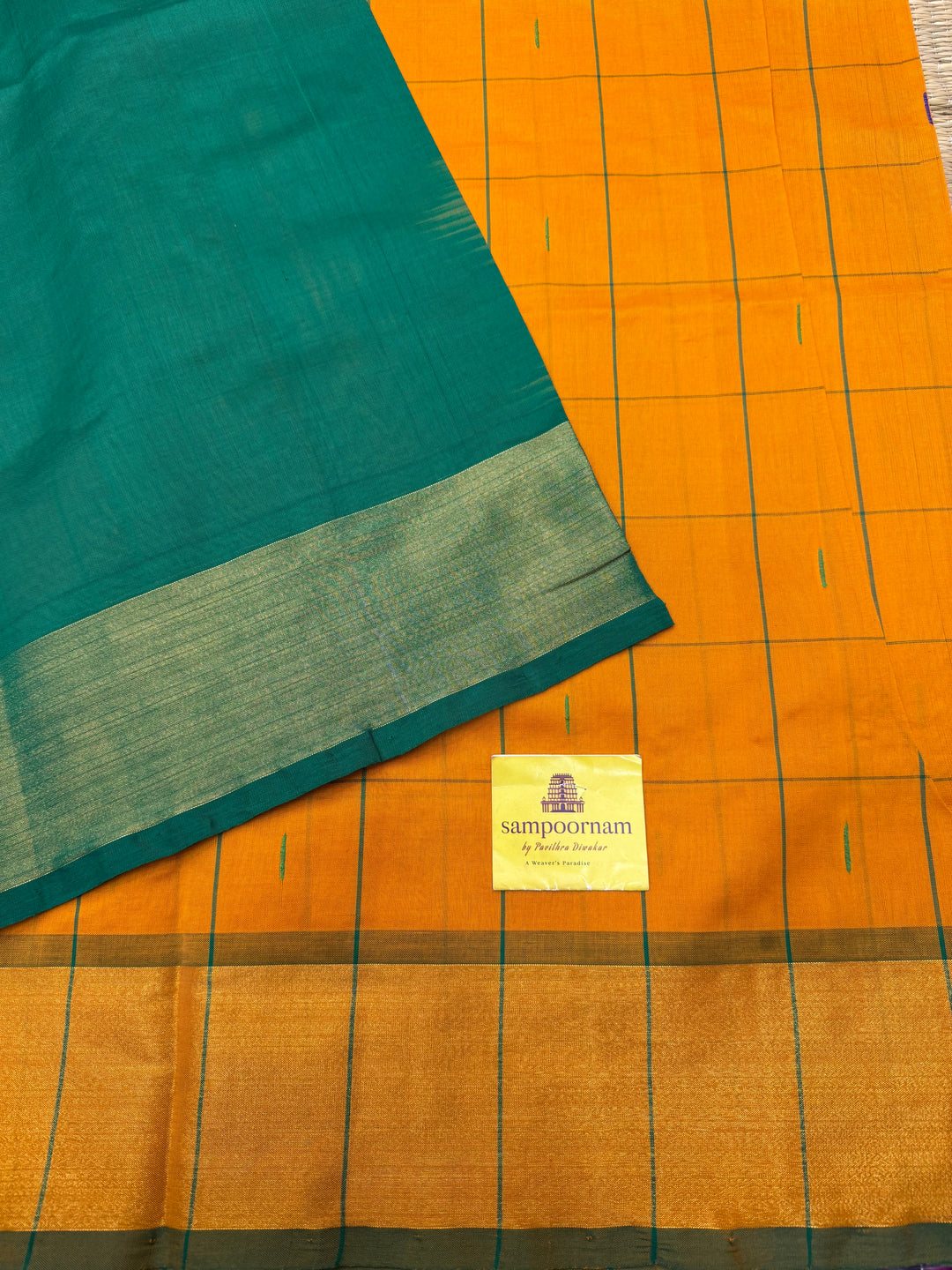 Orange with Green , checks in the body and rain drop thread butta in the body and Pallu Semi Silk Cotton Saree