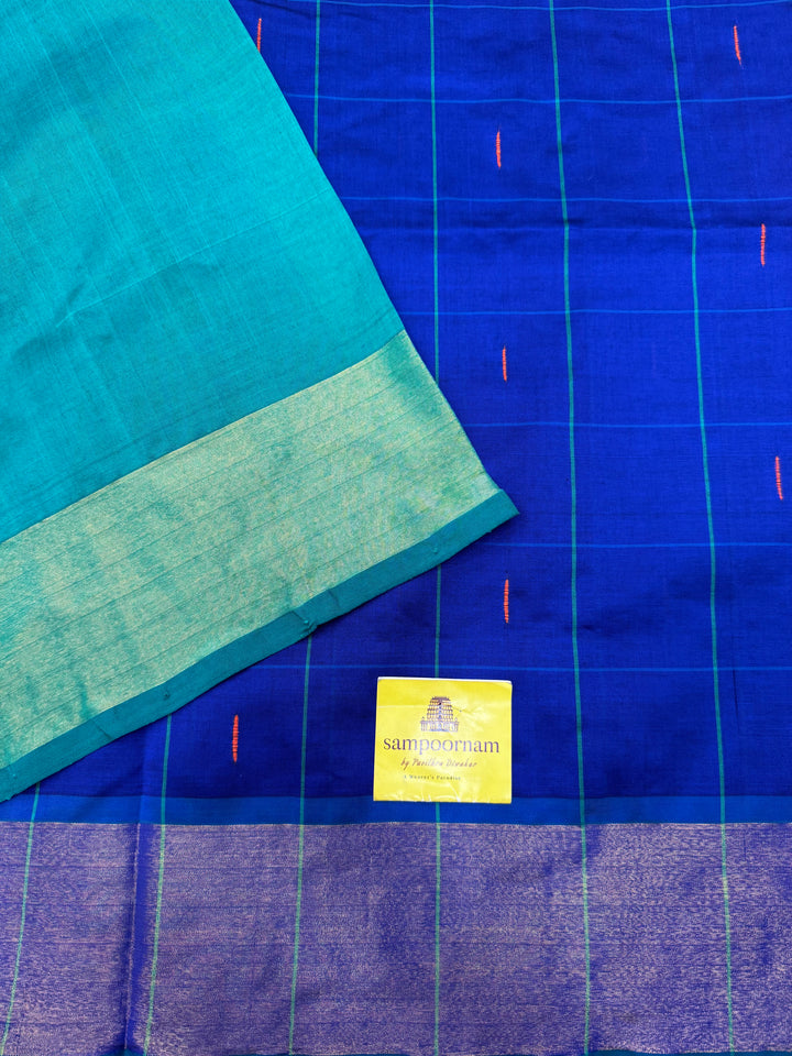 Blue with Green , checks in the body and rain drop thread butta in the body and Pallu Semi Silk Cotton Saree