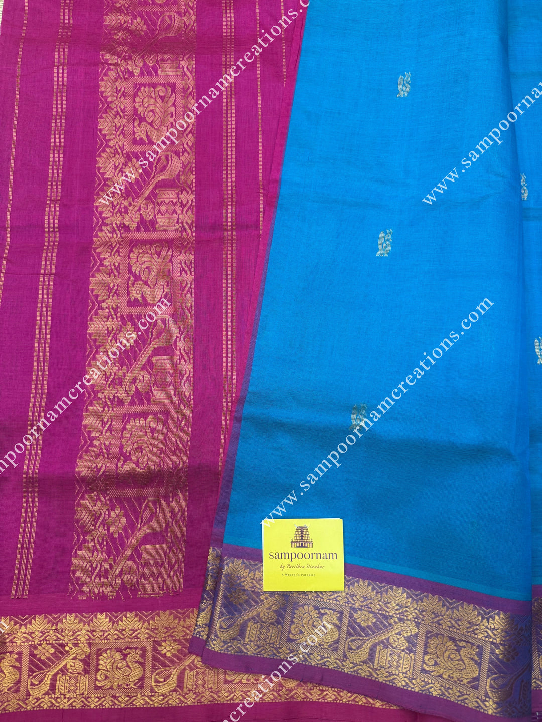Turquoise Blue with Pink , Rich Annam Zari Butta in the body , traditional borders and rich Pallu Silk Cotton Saree