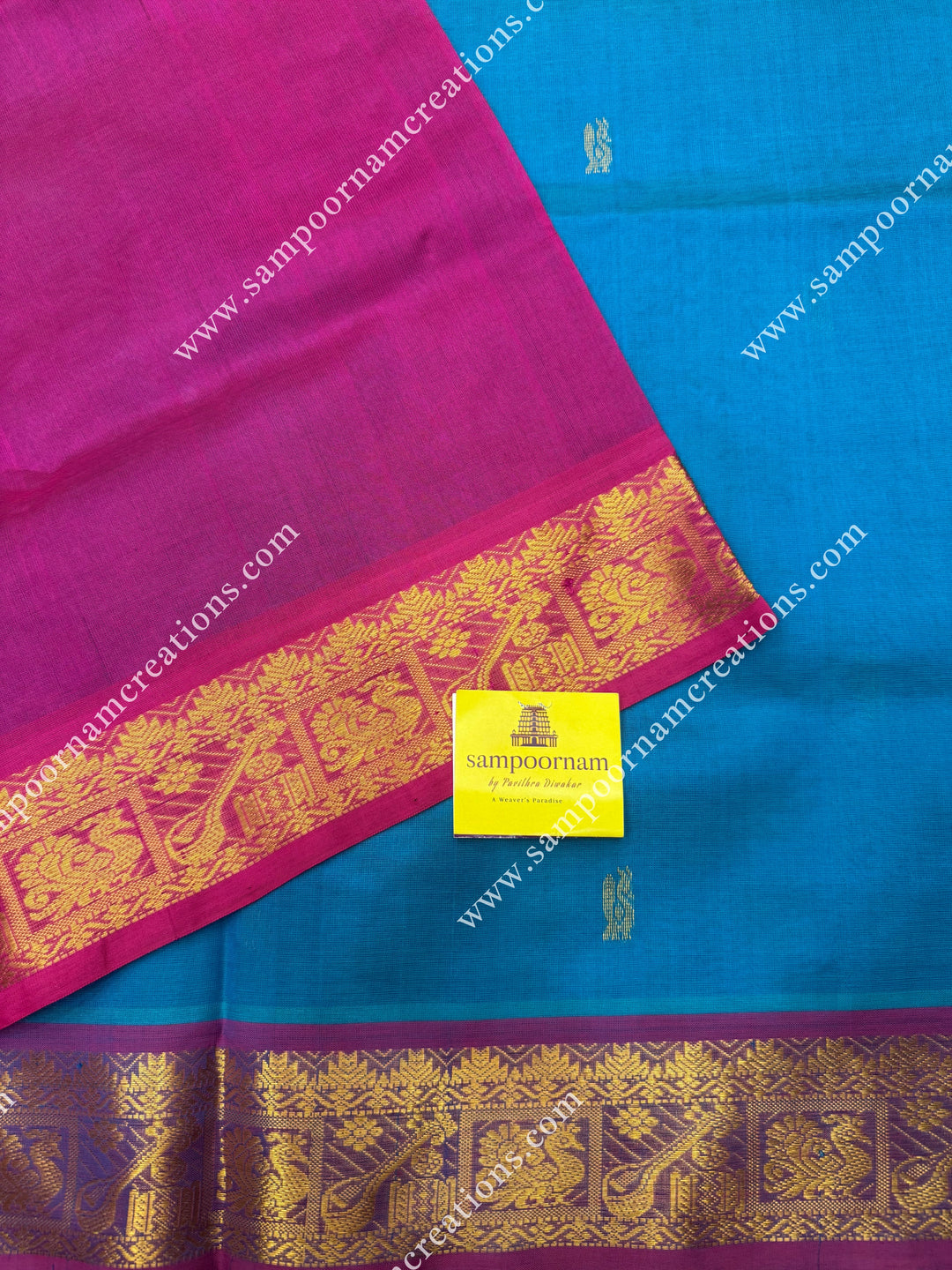 Turquoise Blue with Pink , Rich Annam Zari Butta in the body , traditional borders and rich Pallu Silk Cotton Saree