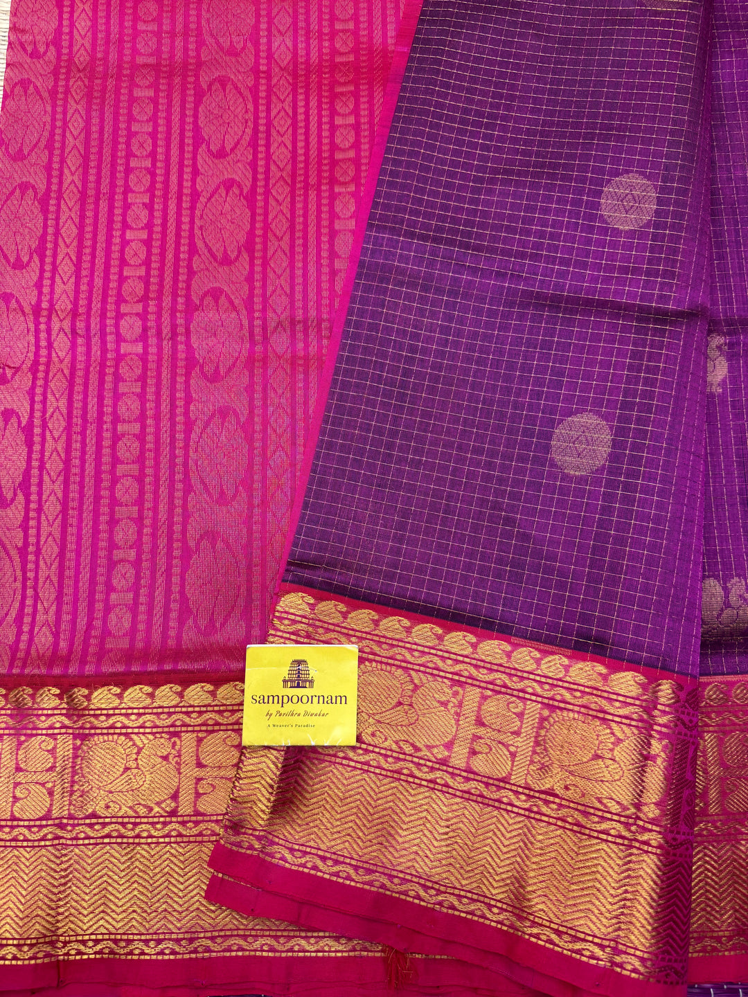 Dark Magenta with Light Magenta  , rich Zari checks with Mayil Chakram butta in the body , traditional one side big borders and rich Pallu Korvai Silk Cotton Saree